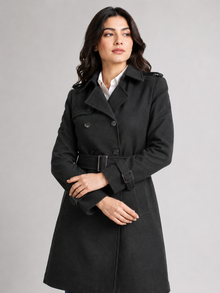 Black double-breasted belted coat for women - crossed arms front view