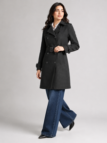 Black belted coat for women - full length walking pose