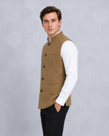 MMASTER tan textured Nehru vest left side profile with hand in pocket