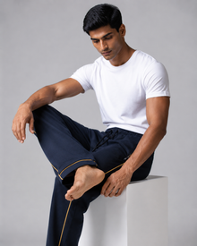 Men's navy blue track pant seated lifestyle view