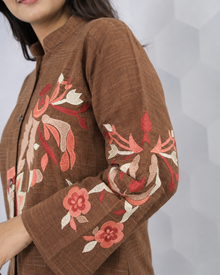 Floral embroidery and sleeve detail on brown co-ord set