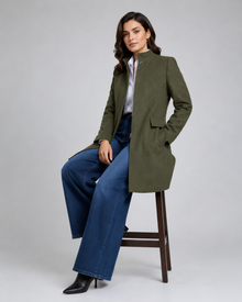 Women's olive green stand collar winter coat seated full look